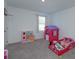 bedroom featuring play kitchen, toy house and a playful toddler bed at 2024 Hemingway Cir, Groveland, FL 34736