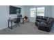 Comfortable bedroom features a desk, an oversized recliner, and a collection of plush toys at 2024 Hemingway Cir, Groveland, FL 34736