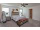 Bright bedroom with a ceiling fan, decorative wall art, and comfortable furniture at 2024 Hemingway Cir, Groveland, FL 34736