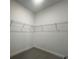 Walk-in closet with built-in shelving for optimal organization at 2036 Sunshine Peak Dr, Minneola, FL 34715