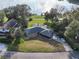 Aerial view of the home showcasing its expansive lot, mature trees, and proximity to the lake at 2422 Topping Pl, Eustis, FL 32726