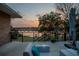 Backyard patio features seating and views of lake at sunset at 2422 Topping Pl, Eustis, FL 32726