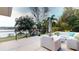 Outdoor patio area offers seating and views of lake at 2422 Topping Pl, Eustis, FL 32726