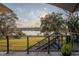 Backyard patio has seating and lake views at 2422 Topping Pl, Eustis, FL 32726