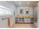 Modern bathroom featuring dual sinks, decorative tile, and glass shower enclosure at 2422 Topping Pl, Eustis, FL 32726