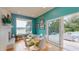 Bright dining room with a view of the lake and patio, featuring a white table and chairs at 2422 Topping Pl, Eustis, FL 32726