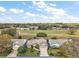 Aerial view of the home in a golf community, showcasing the property's landscaping and prime location at 25073 Riverwalk Dr, Leesburg, FL 34748