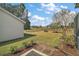 Expansive backyard featuring lush green grass and beautiful landscaping, perfect for outdoor activities at 25073 Riverwalk Dr, Leesburg, FL 34748