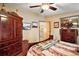 Serene bedroom featuring a king-size bed, wooden furniture, and soft lighting, creating a relaxing atmosphere at 25605 Belle Alliance, Leesburg, FL 34748