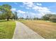 Scenic view of the community, with mature trees and walking path at 25605 Belle Alliance, Leesburg, FL 34748