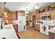 Spacious kitchen featuring white appliances, ample cabinet space, and a brick backsplash design at 25605 Belle Alliance, Leesburg, FL 34748