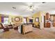 Cozy living room with carpet, ceiling fan, and comfortable seating at 25605 Belle Alliance, Leesburg, FL 34748