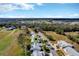 Beautiful aerial view of the neighborhood, showing the tree coverage and access to the golf course at 26148 Glen Eagle Dr, Leesburg, FL 34748