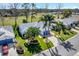 Aerial view of the property featuring a well-manicured lawn and driveway at 26148 Glen Eagle Dr, Leesburg, FL 34748