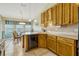 Kitchen area offers light-colored cabinets, neutral countertops, and a stainless steel dishwasher at 26148 Glen Eagle Dr, Leesburg, FL 34748