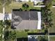 Aerial view of the house showcasing the roof, yard and screened-in patio at 2917 White Cedar Cir, Kissimmee, FL 34741