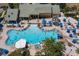 Aerial view of the community pool with sun loungers and umbrellas at 2959 Banana Palm Dr, Kissimmee, FL 34747