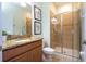 Bathroom with a granite vanity and glass-enclosed shower at 2959 Banana Palm Dr, Kissimmee, FL 34747