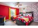 bedroom featuring twin beds, ceiling fan and colorful decor at 2959 Banana Palm Dr, Kissimmee, FL 34747