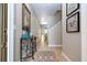 Inviting hallway with a stylish console table and decorative accents, leading to the dining area at 2959 Banana Palm Dr, Kissimmee, FL 34747