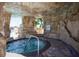 Spa with rock surround and walkway at 2959 Banana Palm Dr, Kissimmee, FL 34747