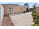 Home's backyard featuring a concrete patio section at 3172 Amberly Ct, The Villages, FL 32163