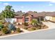 Attractive single-story home with meticulously landscaped front yard and a welcoming walkway at 3172 Amberly Ct, The Villages, FL 32163