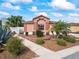 A beautifully landscaped front yard with ornamental grasses, rock beds, and lush plants at 3172 Amberly Ct, The Villages, FL 32163