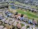 Overhead view of a community with homes nestled around a beautiful golf course and ponds at 320 Bentwood Dr, Leesburg, FL 34748