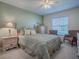 Comfortable bedroom featuring soft colors, natural light, and cozy decor at 320 Bentwood Dr, Leesburg, FL 34748