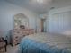 Bedroom featuring a large dresser and access to en suite bathroom and walk-in closet at 320 Bentwood Dr, Leesburg, FL 34748