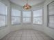 Bright breakfast nook with tiled flooring and a decorative light fixture at 32708 Westwood Loop, Leesburg, FL 34748