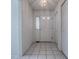 Bright foyer with tile flooring, white walls, and closet space near the front door at 32708 Westwood Loop, Leesburg, FL 34748