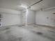 Spacious two-car garage with ample room for storage, work bench or parking at 32708 Westwood Loop, Leesburg, FL 34748