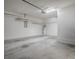Attached garage with lighting and plenty of space for storage and organization at 32708 Westwood Loop, Leesburg, FL 34748