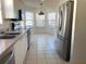 Well-lit kitchen featuring stainless steel appliances and a bay window with breakfast nook at 32708 Westwood Loop, Leesburg, FL 34748