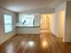 Laminate flooring in a living area showcasing an open floor plan and kitchen at 32708 Westwood Loop, Leesburg, FL 34748