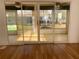 Bright sunroom features sliding glass doors, ceiling fan, and lots of natural light at 32708 Westwood Loop, Leesburg, FL 34748