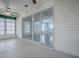 A sunroom featuring floor-to-ceiling windows and views into the backyard at 32708 Westwood Loop, Leesburg, FL 34748