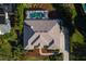 Aerial view of roof shows great landscaping around the property with mature trees at 39136 Harbor Hills Blvd, Lady Lake, FL 32159