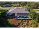 Back of house features a screened pool, and lush landscaping offering privacy at 39136 Harbor Hills Blvd, Lady Lake, FL 32159