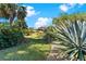 Lush backyard featuring a well-manicured lawn and an enclosed pool at 39136 Harbor Hills Blvd, Lady Lake, FL 32159