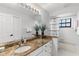 Bathroom vanity with granite countertops, double sinks and decorative plants at 39136 Harbor Hills Blvd, Lady Lake, FL 32159