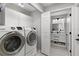 Bathroom located near washer and dryer; features modern vanity, white sink, and ample storage at 39136 Harbor Hills Blvd, Lady Lake, FL 32159