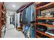 Spacious walk-in closet with custom wood shelving and ample hanging space at 39136 Harbor Hills Blvd, Lady Lake, FL 32159