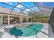 Beautiful screened-in pool and spa adjacent to a covered patio with seating at 39136 Harbor Hills Blvd, Lady Lake, FL 32159