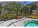 Secluded screened pool area with a vibrant vertical garden, providing a private and serene oasis at 39136 Harbor Hills Blvd, Lady Lake, FL 32159