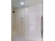 Modern shower with a built-in bench and sleek glass door at 39136 Harbor Hills Blvd, Lady Lake, FL 32159