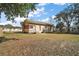 Wide view of backyard and exterior of home at 401 S 6Th St, Leesburg, FL 34748