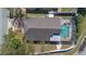 Aerial view of the home with a screened-in pool and well-manicured yard at 489 Bohannon Blvd, Orlando, FL 32824